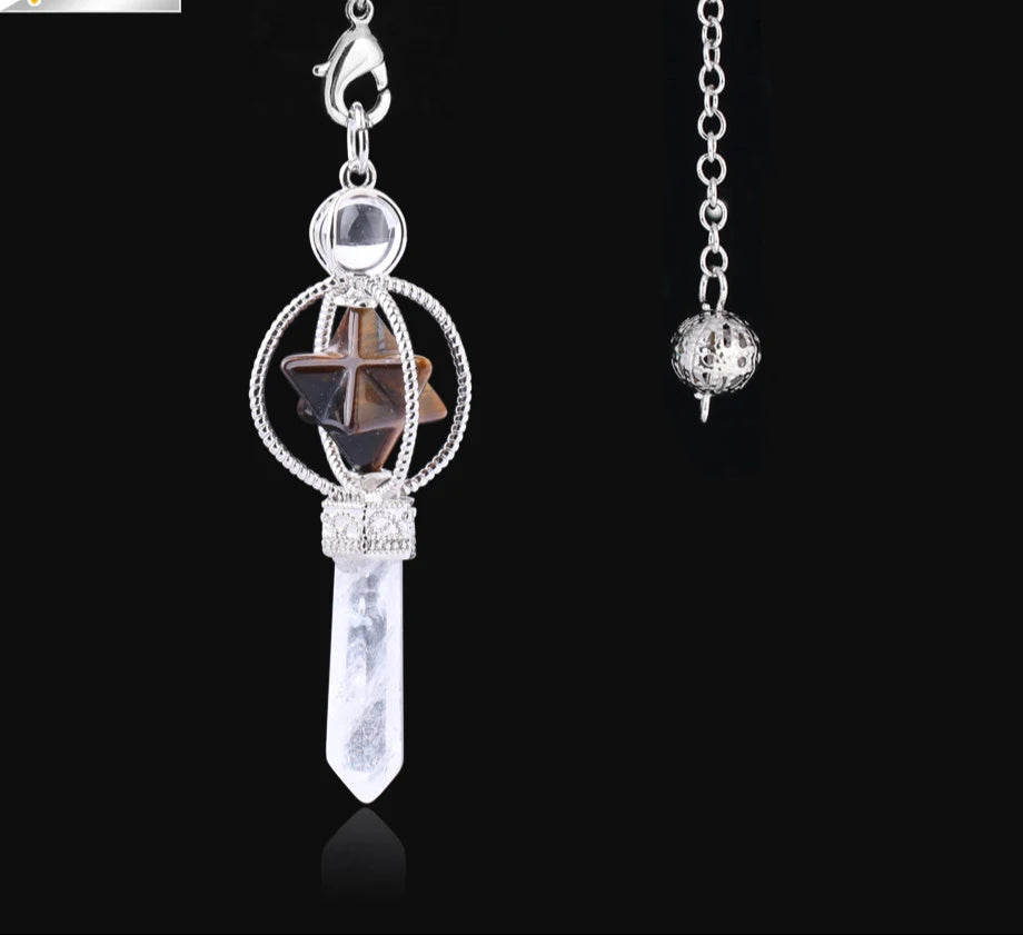 Jewelry pendant with star and crystal design on a black background