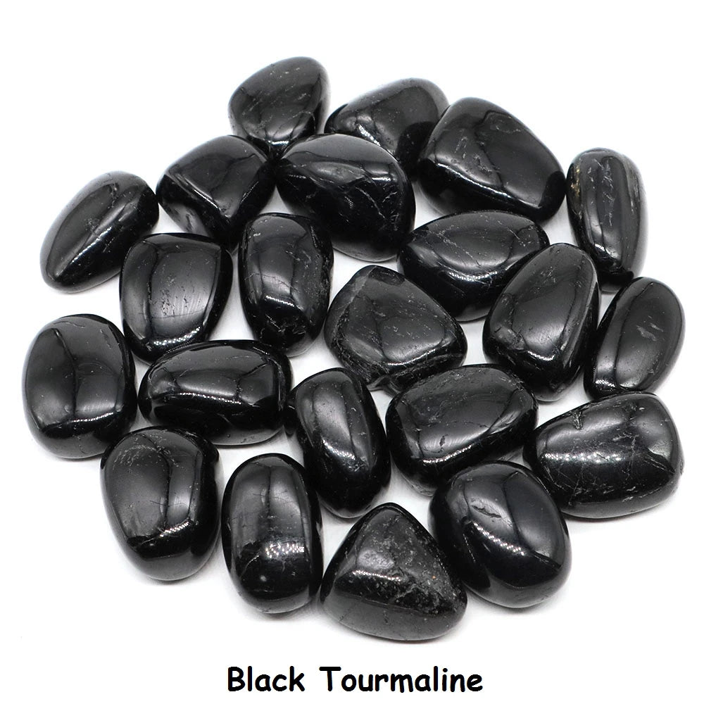 Black tourmaline stones on a white background