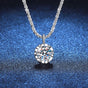 Silver necklace with a round diamond pendant on a blue textured background