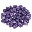 Purple stones on a white background
