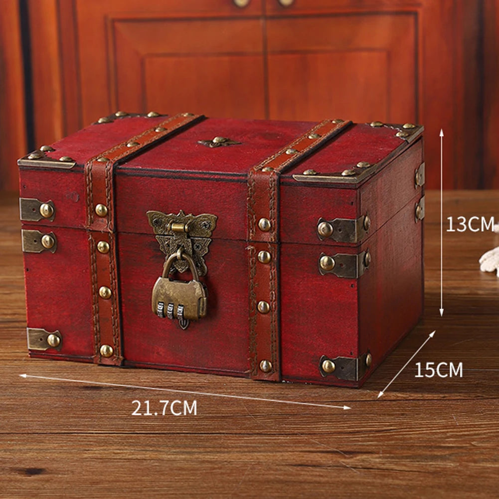 Red wooden treasure chest with brass lock and measurements on a wooden surface