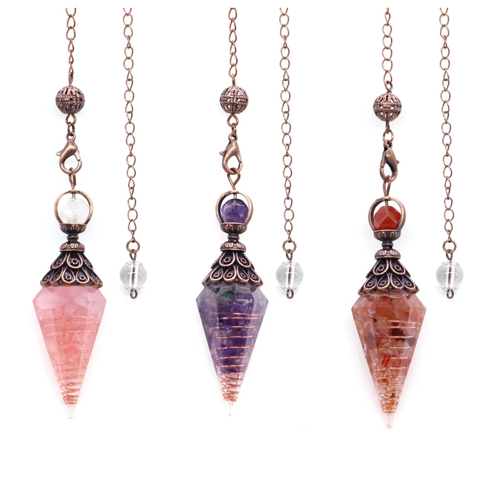 Set of four crystal pendulums on chains with different colored stones.