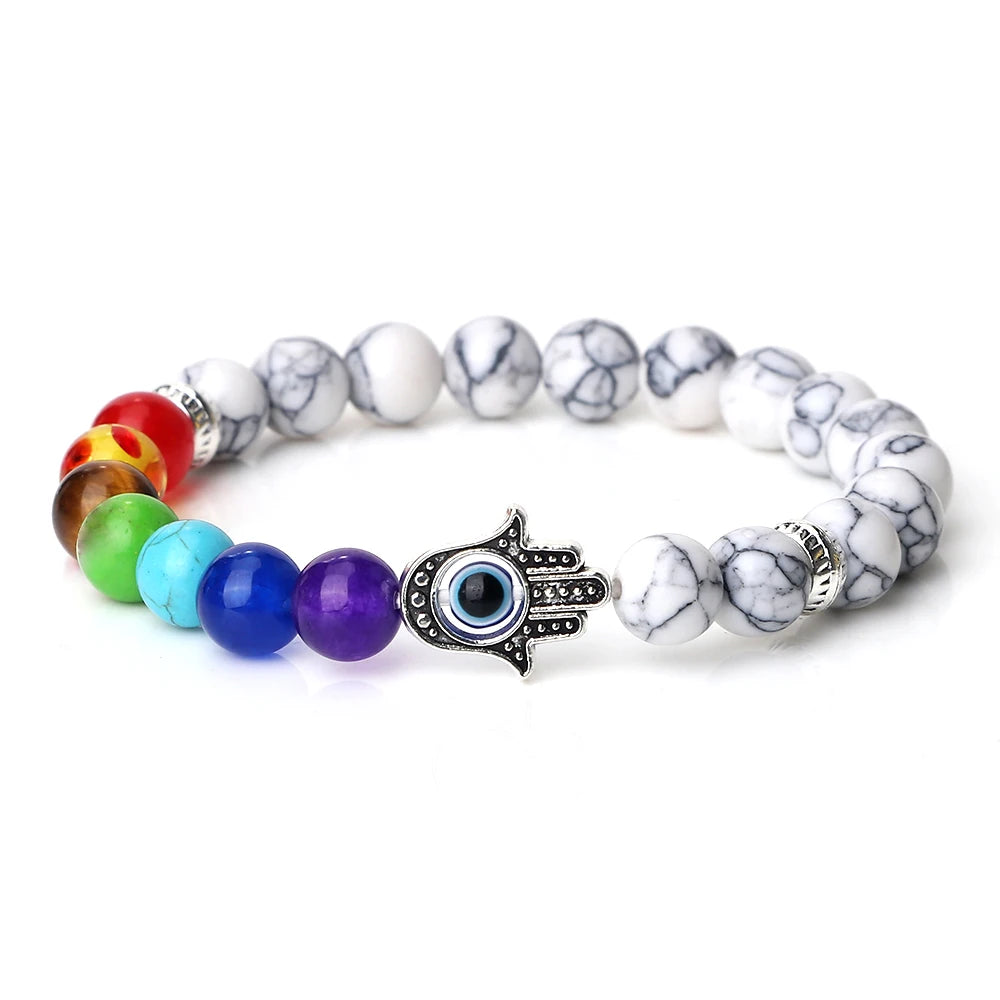 Multicolored beaded bracelet with a Hamsa hand charm on a white background