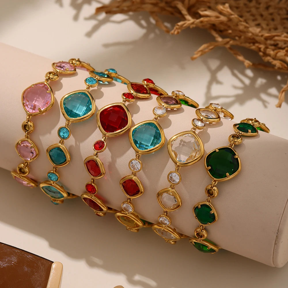 Colorful gemstone bracelet on a mannequin hand with a neutral background