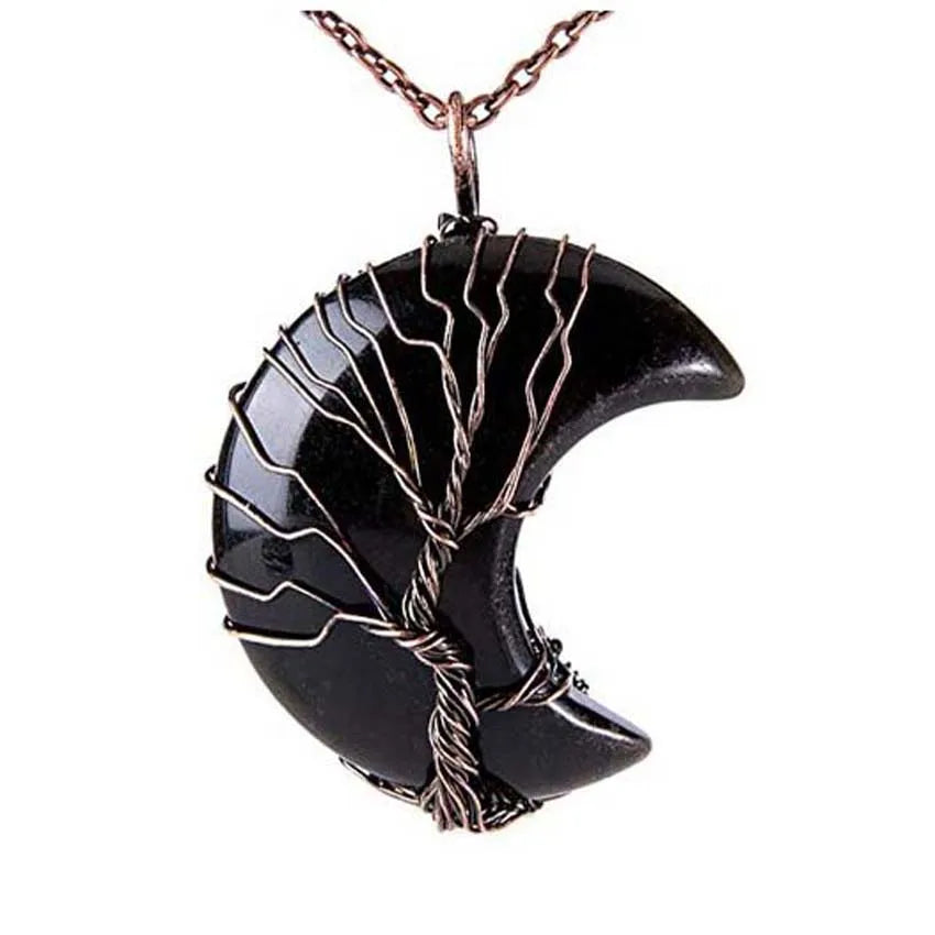 Black crescent moon pendant with copper wire wrapping on a white background