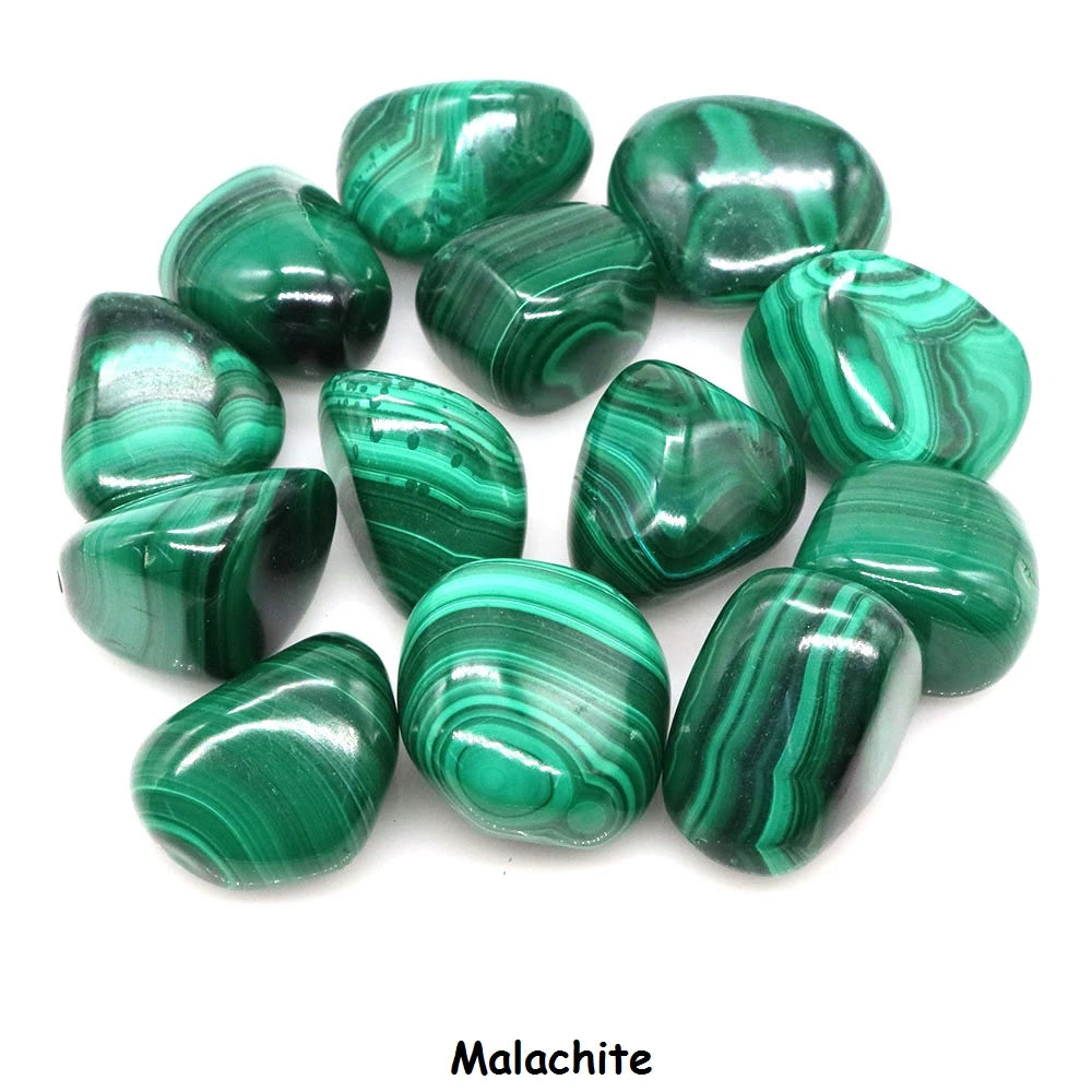 Collection of green malachite stones on a white background