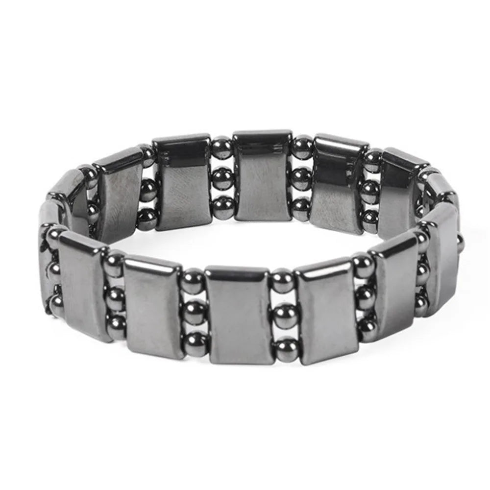 Silver bracelet with square links and beads on a white background