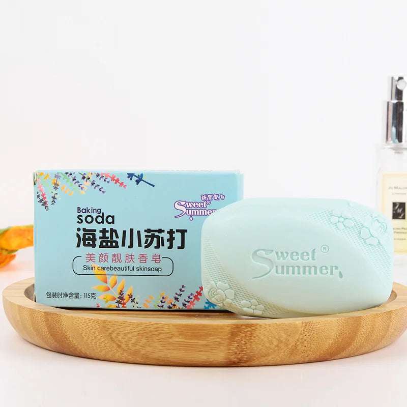 Bar of soap on a wooden dish with packaging labeled 'sweet summer' on a light background