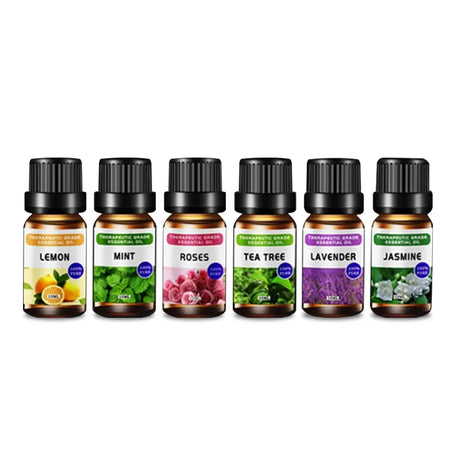 Set of essential oil bottles with labels for lemon, mint, roses, tea tree, lavender, and jasmine on a white background.