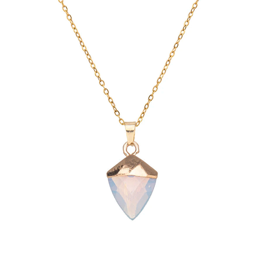 Necklace with a gold and clear stone pendant on a white background