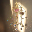 Decorative hanging crystal mobile with geometric design on a neutral background