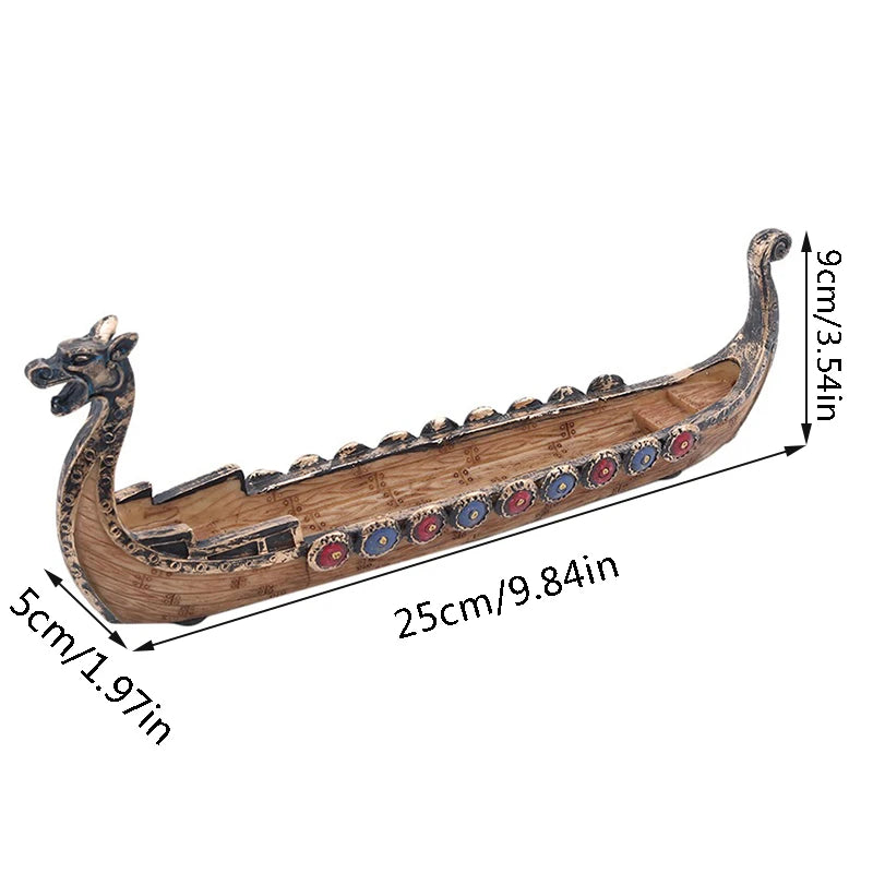 Model of a Viking longship with decorative elements and measurements on a white background