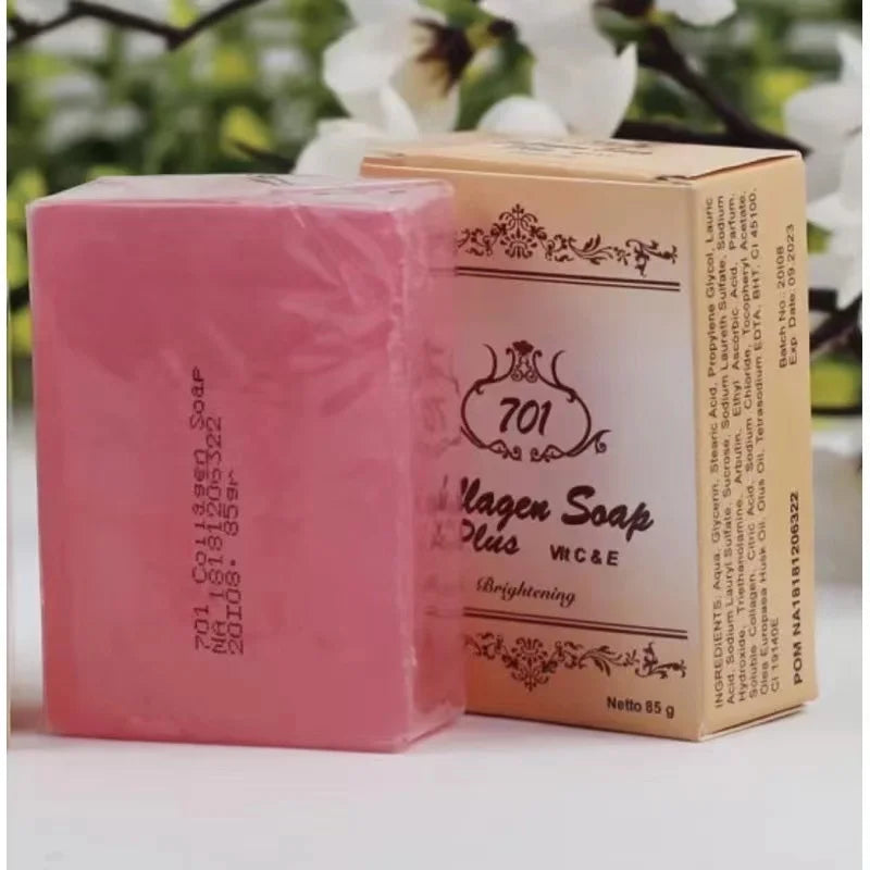 Pink soap bar with packaging featuring '701' branding on a blurred natural background
