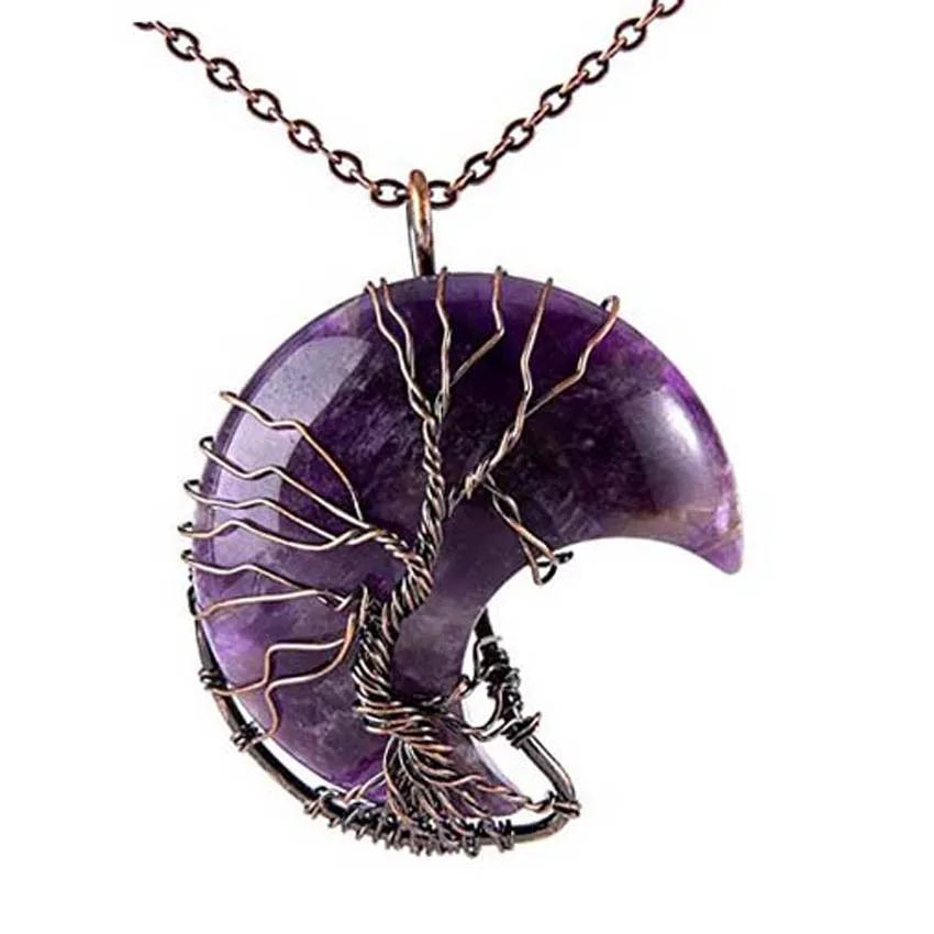 Purple crescent moon pendant with tree design on a white background