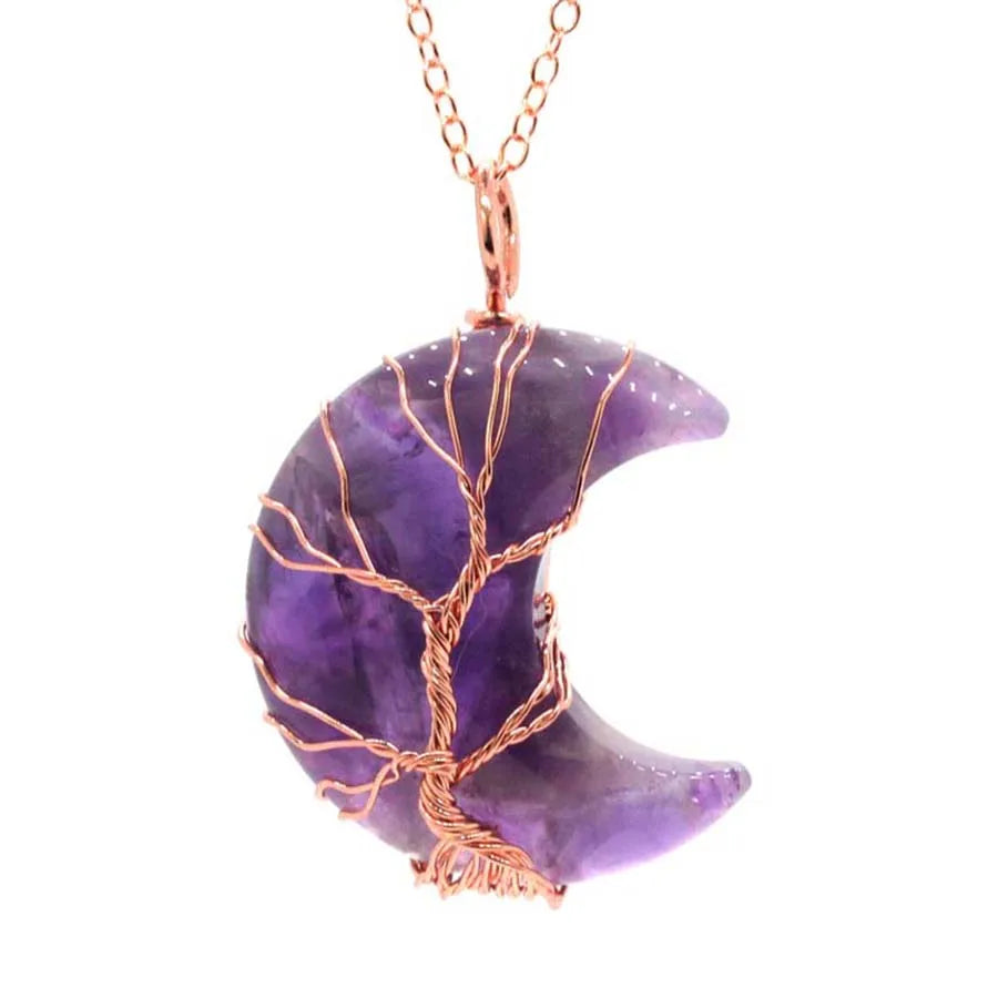 Purple crescent moon-shaped pendant with copper wire wrapping on a white background