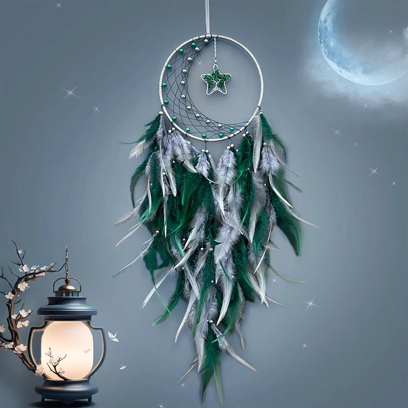 Dreamcatcher with green feathers against a starry night sky