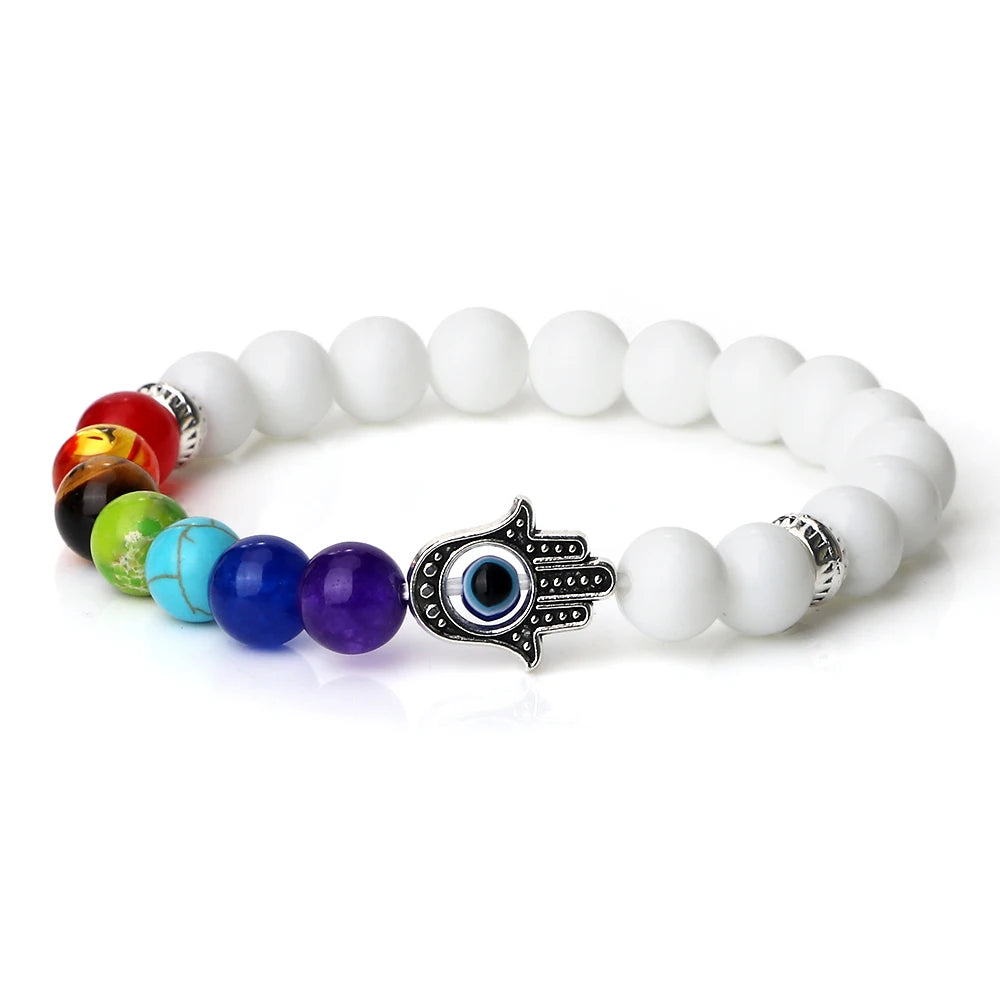 Bracelet with white beads and colorful accents on a white background