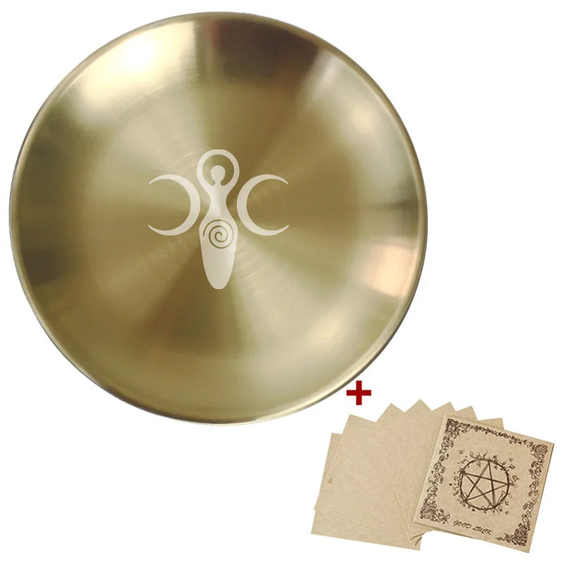 Gold singing bowl with a symbol and cards featuring similar designs on a white background