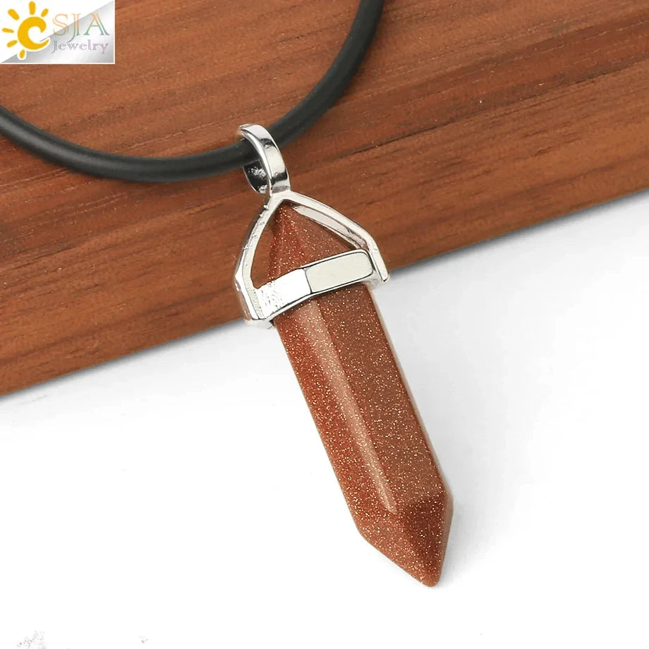 Brown stone pendant on a black cord against a wooden background
