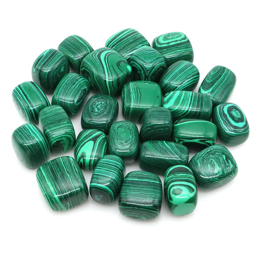 Green malachite stones on a white background