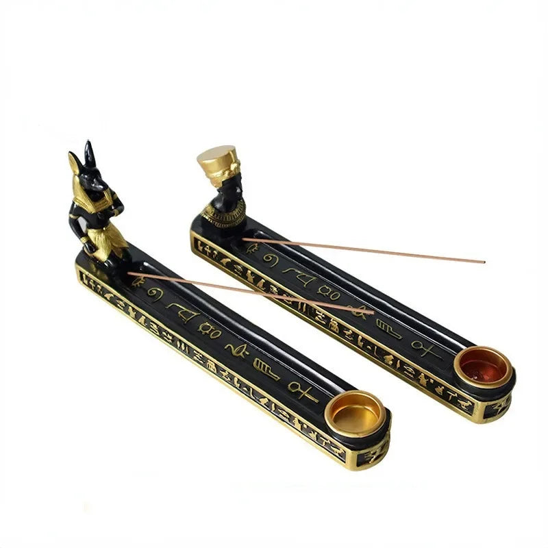 Decorative incense holder with Egyptian-themed design on a white background