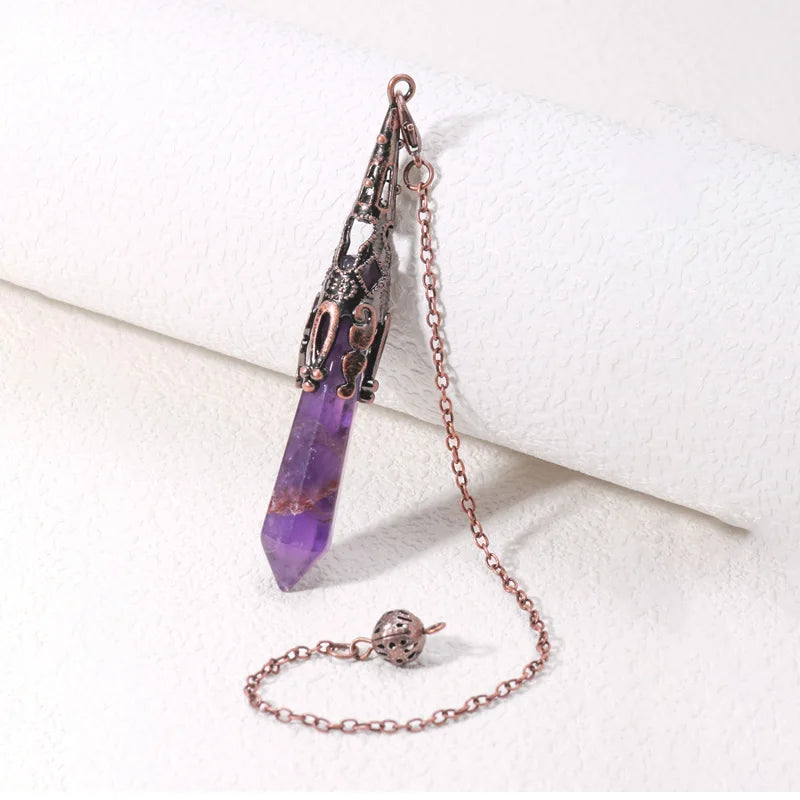 Purple crystal pendant with chain on a white background