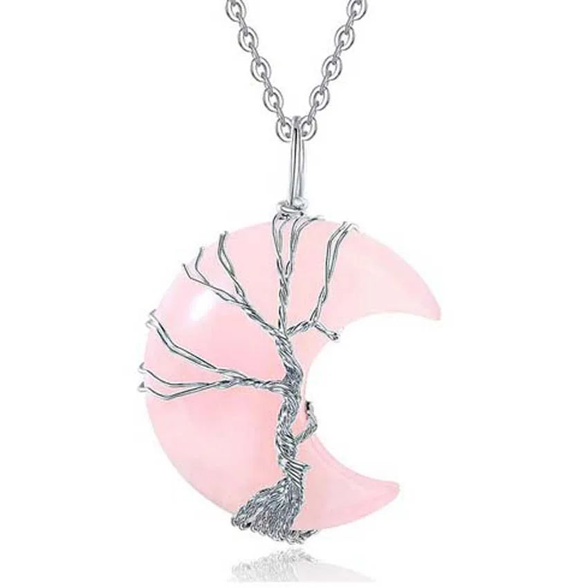 Pink crescent moon and silver tree branch pendant on a white background