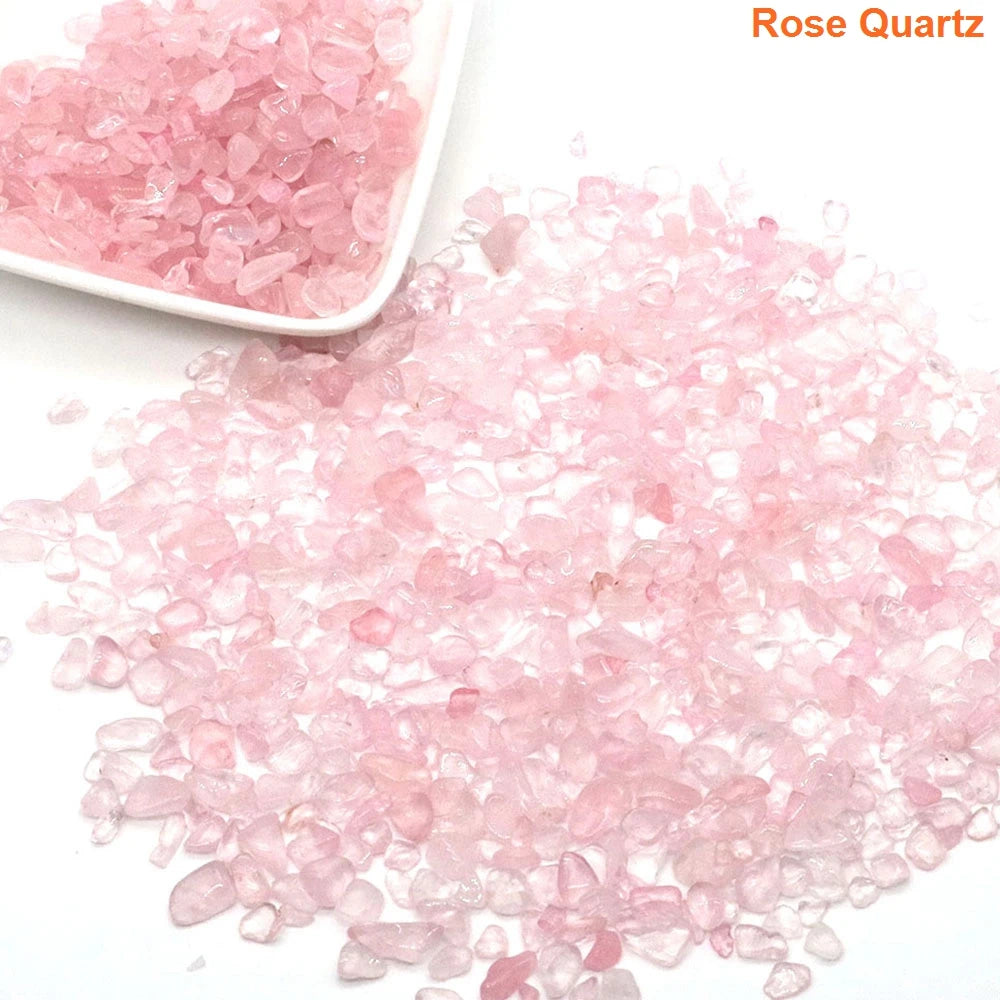 Pink rose quartz crystals on a white surface with 'Rose Quartz' text.