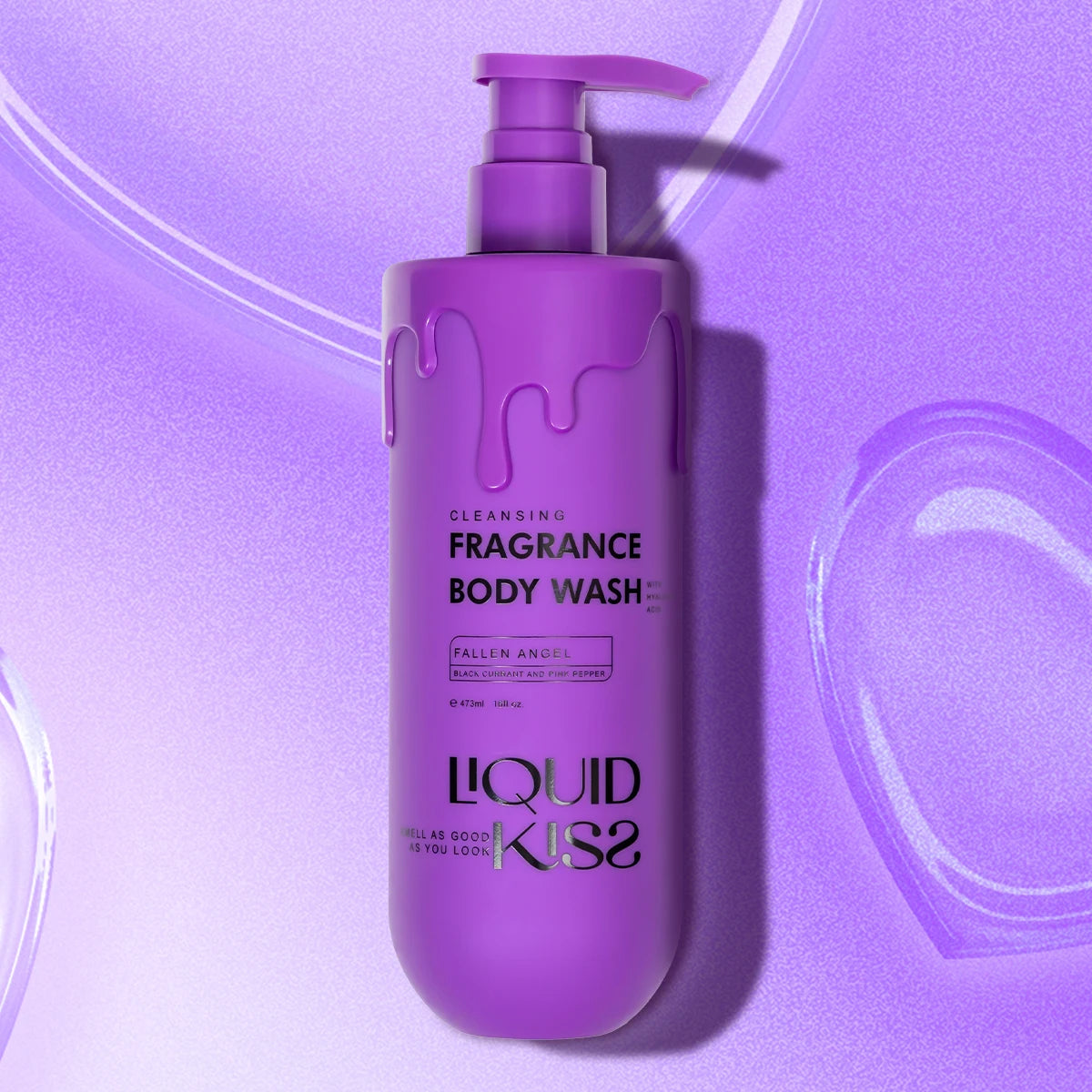 Purple body wash bottle with pump on a purple background