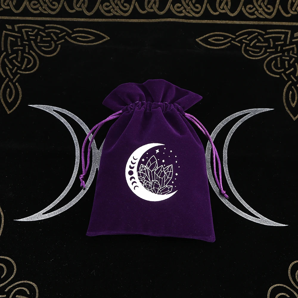 Purple drawstring bag with a white moon and crystal design on a black background with Celtic patterns.