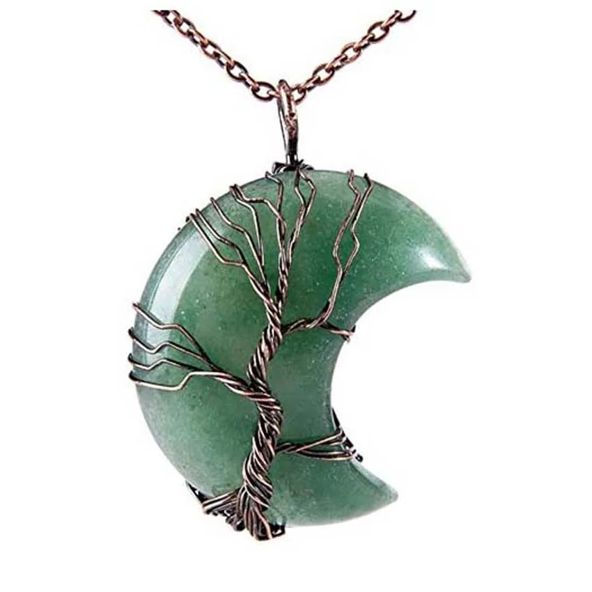 Green stone pendant with tree design on a white background