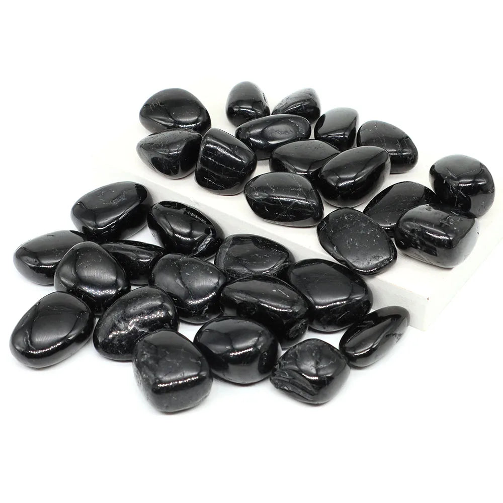 Collection of black stones on a white background