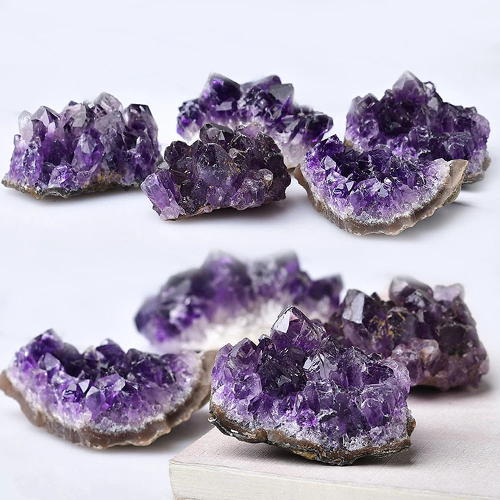 Amethyst crystal clusters on a white background