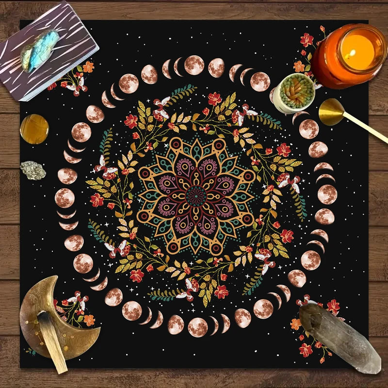 Decorative mat with mandala design, moon phases, and celestial elements on a wooden surface.