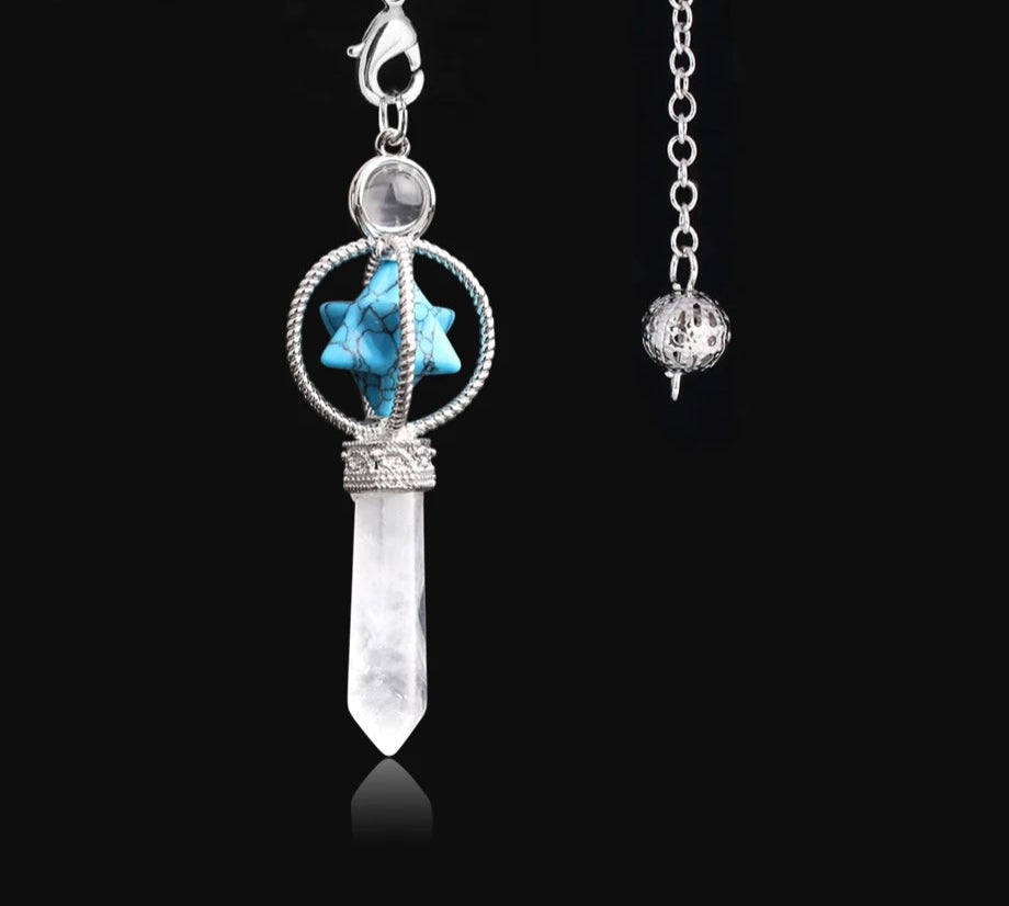 Jewelry pendant with turquoise stone and crystal on a black background