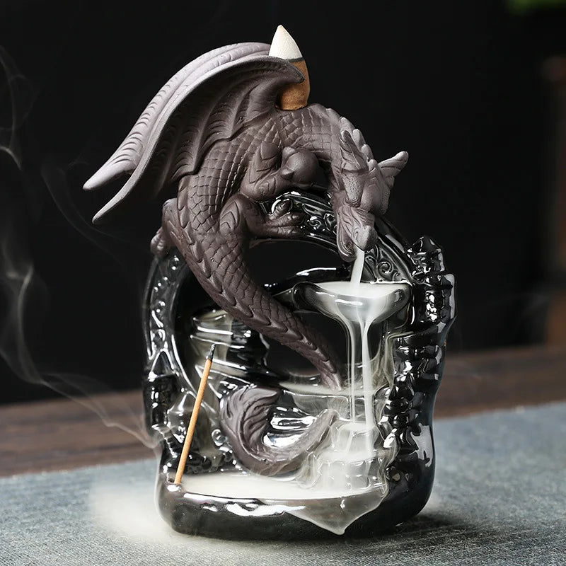 Dragon-shaped incense burner with incense sticks on a dark background