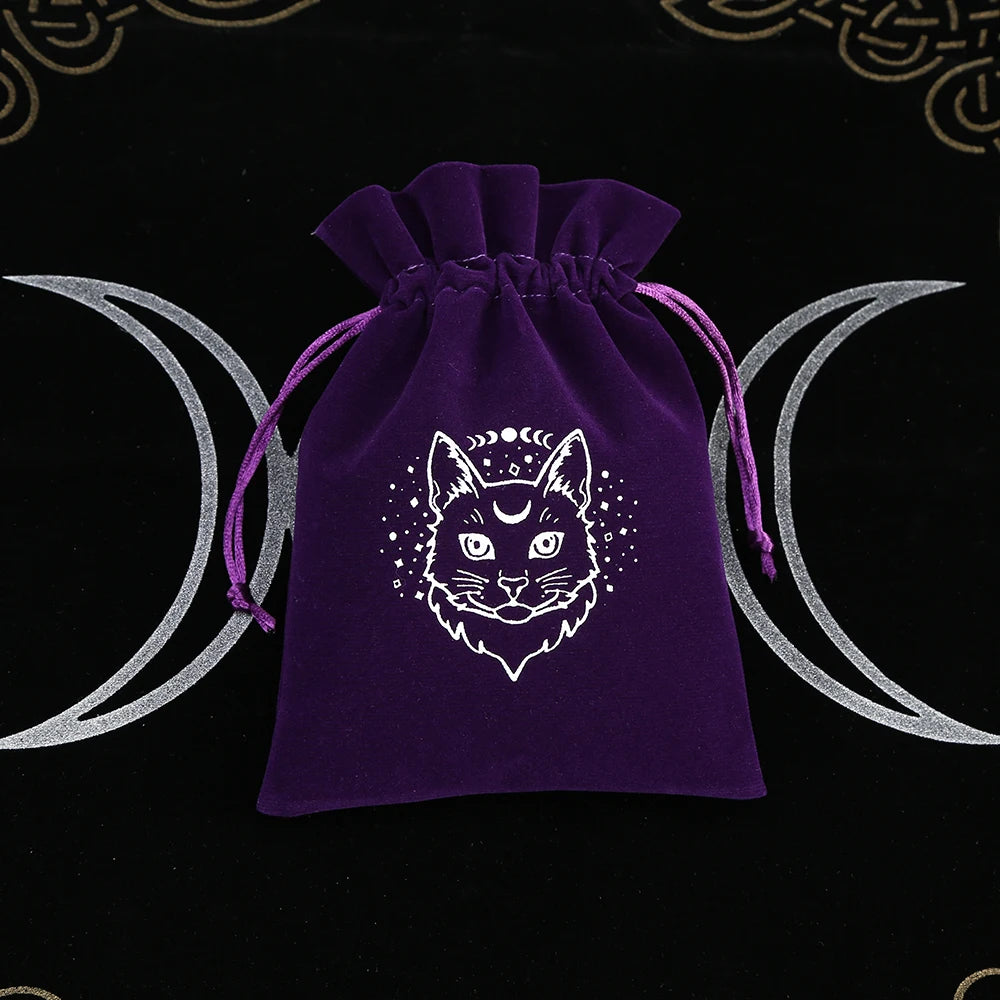 Purple drawstring bag with a cat design on a black background with moon symbols.