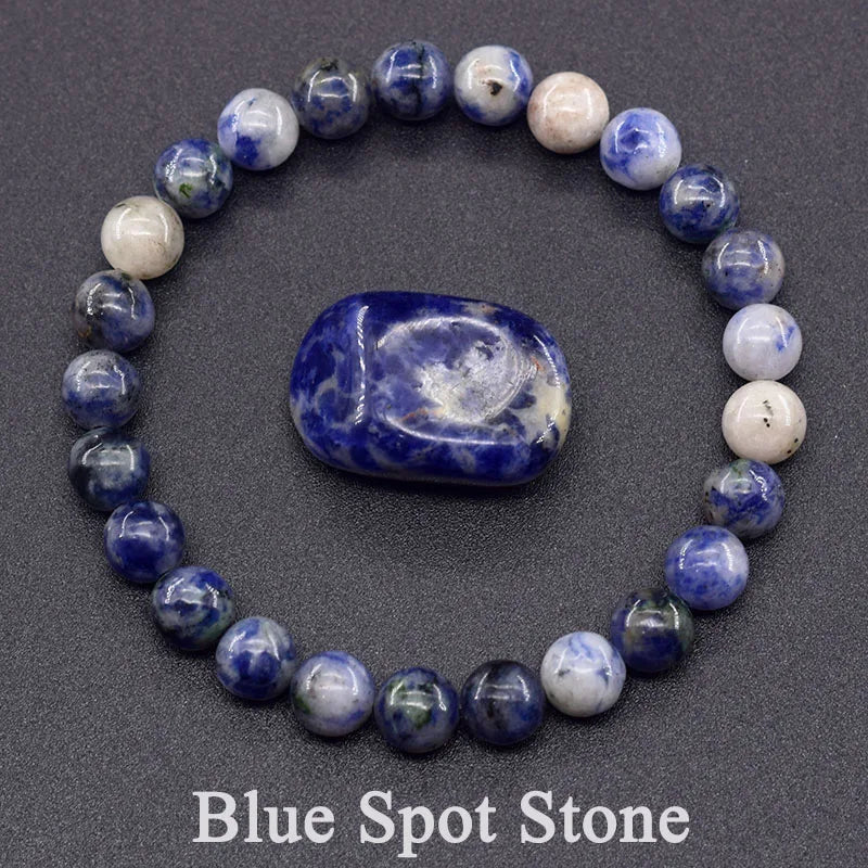 Beaded bracelet with a central blue stone on a dark background, labeled 'Blue Spot Stone'.