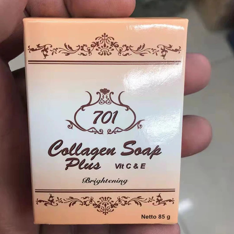 Box of 701 Collagen Soap Plus with decorative elements held by a hand.