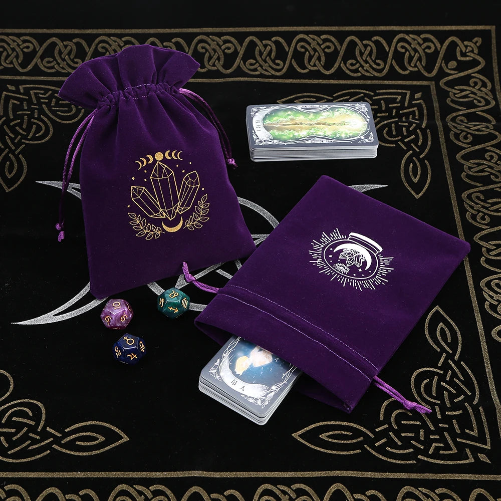 Purple velvet bags with crystal design on a black and gold patterned surface