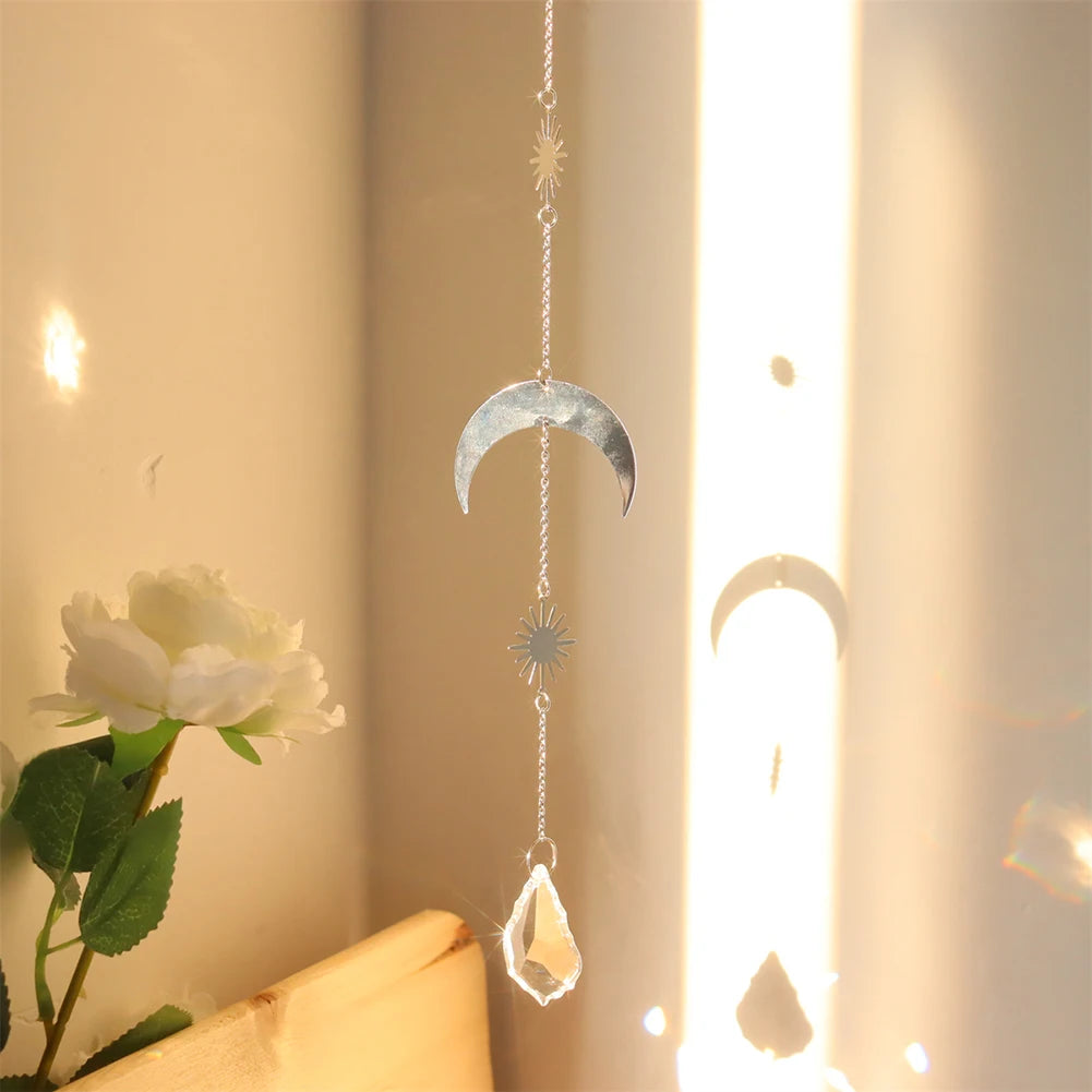 Decorative hanging moon and crystal pendant with a soft light background