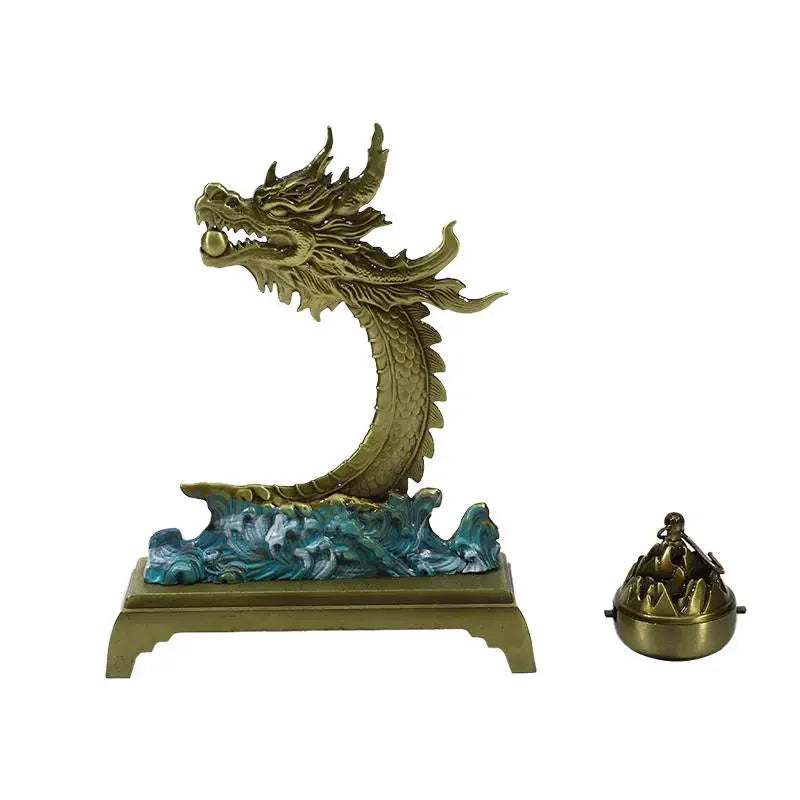 Bronze dragon sculpture with wave base and incense burner on a white background