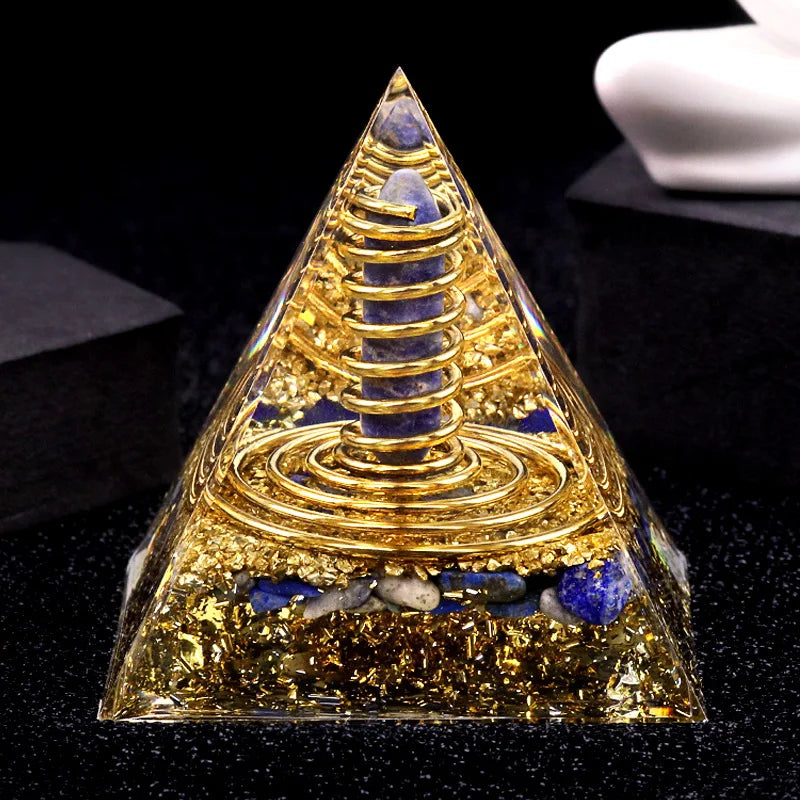 Pyramid-shaped object with gold and blue elements on a black background