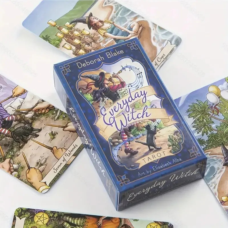 Box of 'Everyday Witch' tarot cards with tarot cards displayed around it on a white background.