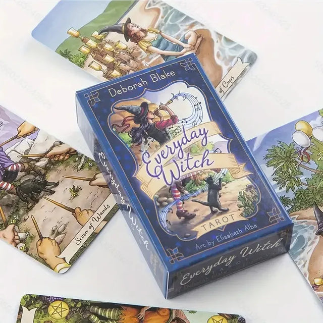 Box of 'Everyday Witch' tarot cards with tarot cards displayed around it on a white background.