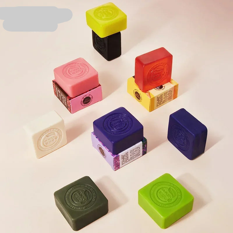 Colorful square soaps from BIOAQUA on a light background