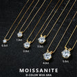 Gold necklaces with moissanite pendants of different carat weights on a black background.