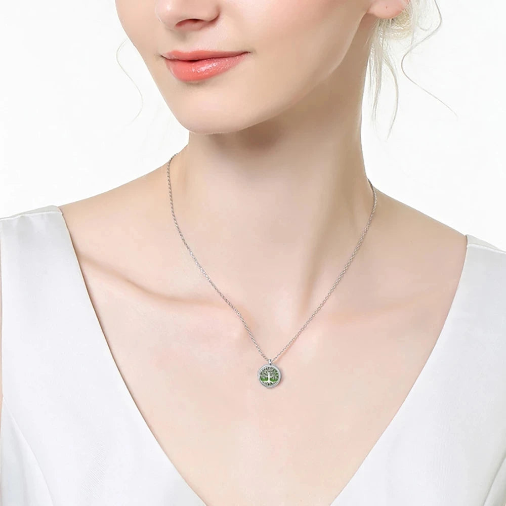 Necklace with a green pendant worn by a model on a white background