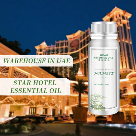 Essential oil bottle with a blurred hotel and restaurant in the background