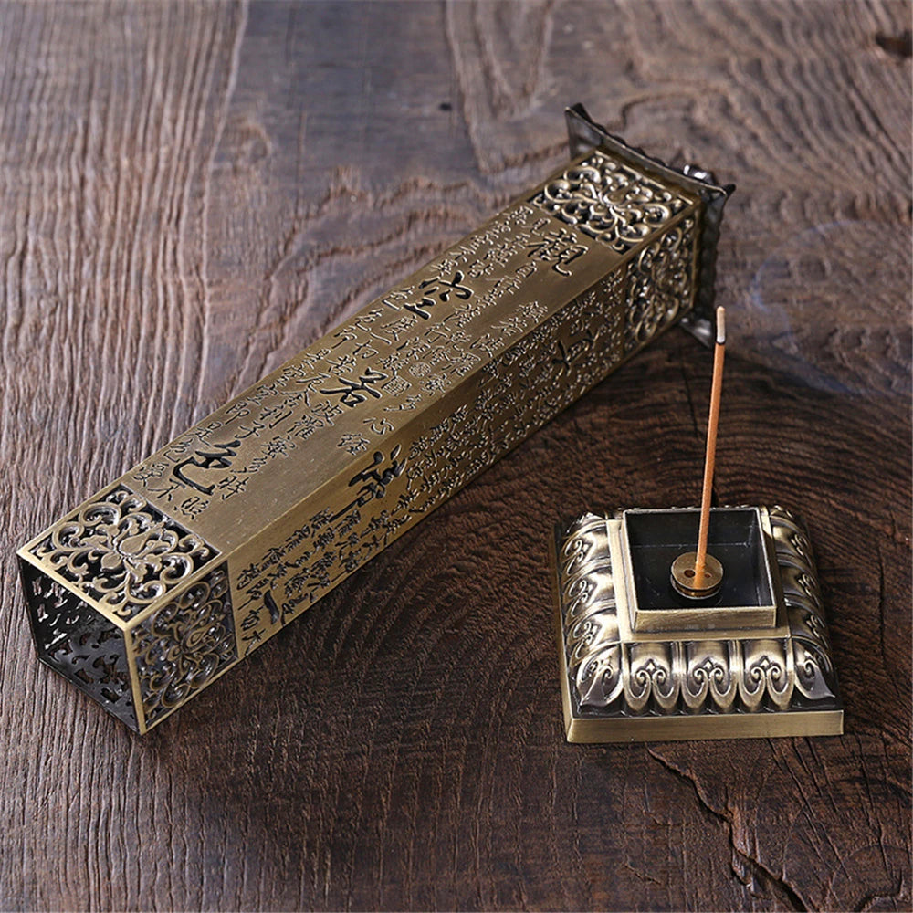 Decorative incense holder with incense stick on a wooden surface